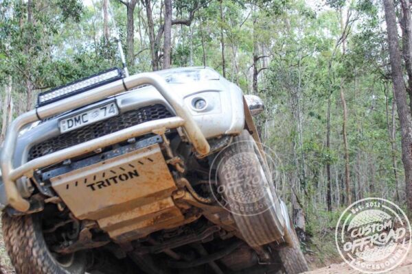Action shot of Mitsubishi Triton 4WD with bash plates from Custom Offroad Accessories
