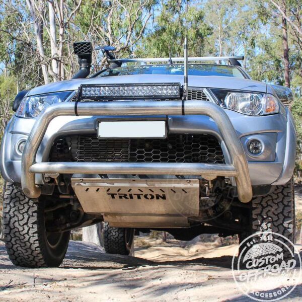 Mitsubishi Triton Ml-MN driving on sand with bash plates installed by Custom Offroad Accessories